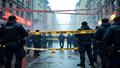 A police ribbon hangs as smoke drifts over a cordoned street, while reporters swarm for answers.