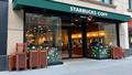 Empty Starbucks storefront with abandoned seasonal signage, chairs stacked like a caffeine Jenga, and a lone mermaid logo wondering where the customers went.