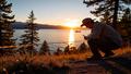 Sunrise over Lake Tahoe with caution tape fluttering and a ranger examining pine needles for clues.