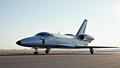 Dream Chaser spaceplane posing on a runway like a shuttle’s younger cousin who lifts.