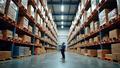 A warehouse packed with pallets, a spreadsheet glare, and a CFO contemplating tariff-induced doom.