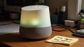Dusty Google Home on cluttered counter, owner shouting, four dots glowing like a confession light, sticky note reads 'try again' next to unplugged power cable.