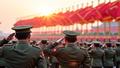 A solemn Pyongyang procession as veterans salute before a radiant banner and a sea of fluttering flags.