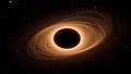 A black hole silhouette with a latte-like accretion disk swirls against a starry backdrop.
