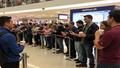A queue winds through the mall as fans await a digital critter drop, phones raised and coffee cups clutched like sacred relics.
