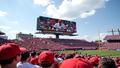 Bowling Green's billboard looms over a packed stadium, fans reacting with a mix of confusion and awe.