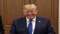 Canadian PM Carney smiles during a briefing as Trump touts a 'productive' call on trade.