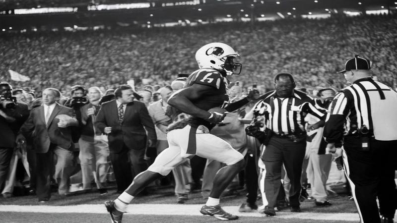 Jefferson jogs onto the field amid cheering fans, a water bottle for moral support, and the stadium lights winking approvingly.