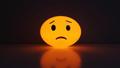 TBD while a shrug emoji light glows.