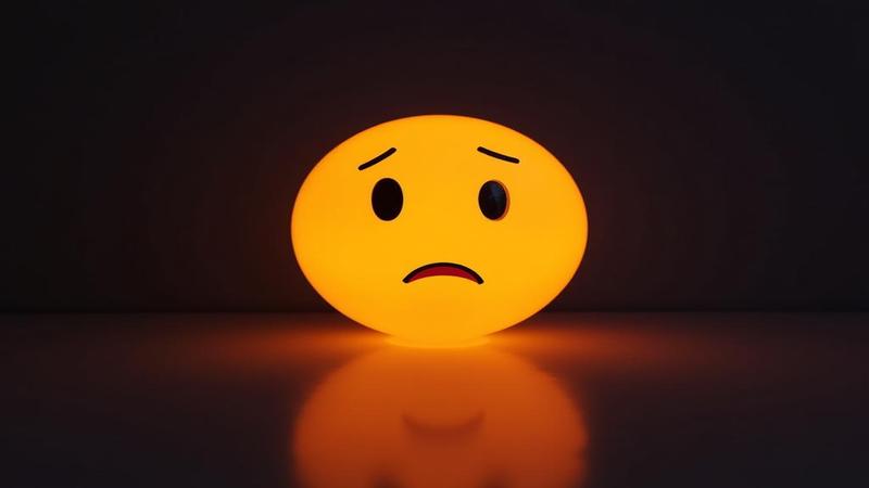 TBD while a shrug emoji light glows.
