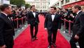 Three megastars on a red carpet, baffled by the camera, while marketers scribble improbable plot pitches.
