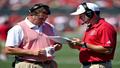 Primary image shows a dejected McMillan on the sideline clutching a coffee mug labeled 'Neck Day' while a trainer consults a playbook.