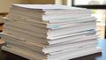 Realtor stacks contracts as buyers pretend they're calm amid market suspense.