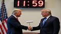 Executives handshake under a countdown clock reading 11:59:59, while a remote control waves a tiny white flag.